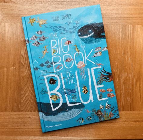 the big book of the blue by yuyai dimma on a wooden table