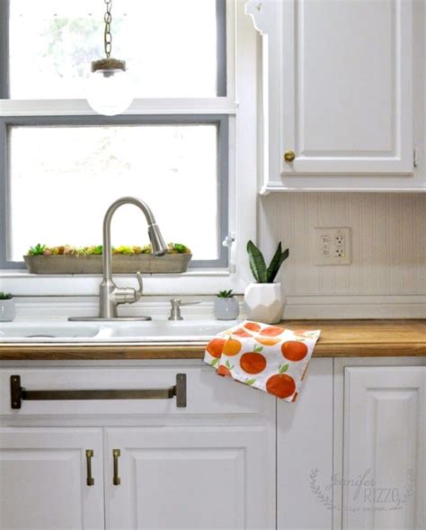 Sink area mini-makeover with brass towel bar under the sink - Jennifer ...