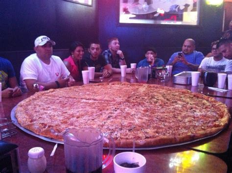 Yep! It's that Huge! That's me in the White Shirt and Hat. @ Big Lou's Pizza in San Antonio ...