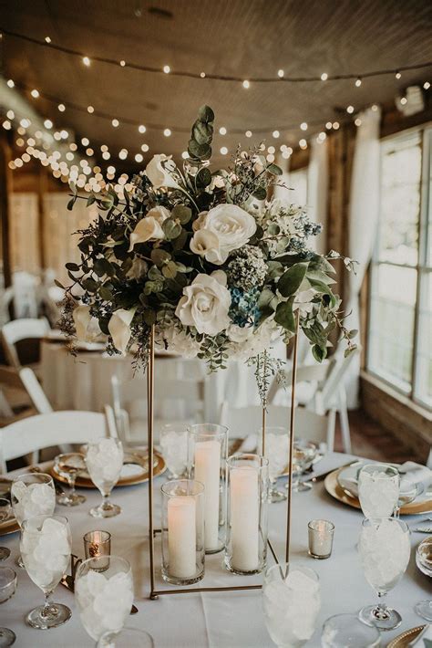 Modern wedding centerpiece with tall gold cubes, large floral arrangements and… | Modern wedding ...