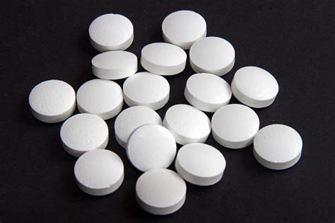 White Round Pills Stock Photo - Download Image Now - iStock