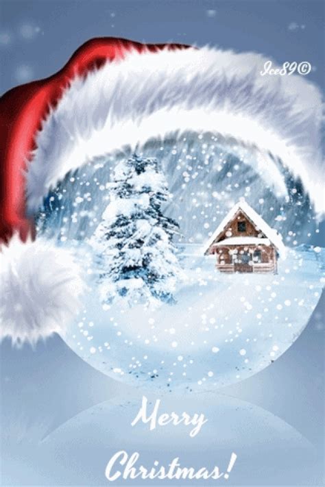 a santa hat on top of a snow globe with a small house in the background