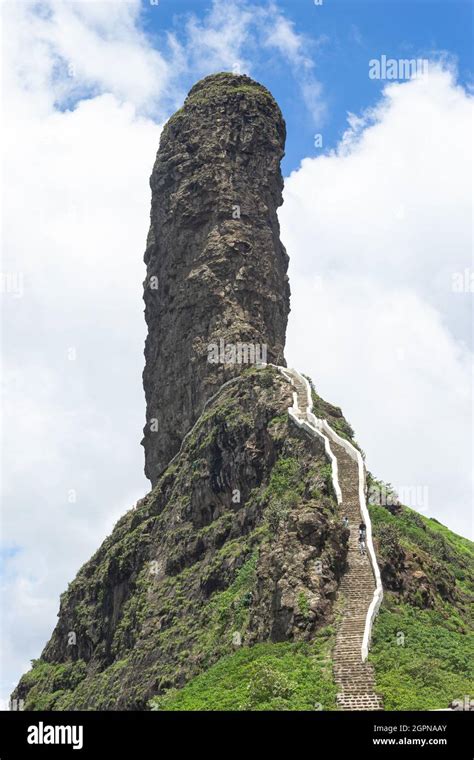 View of stairs and Tungi hill rock, Mangi Tungi, Nashik, Maharashtra, India. Prominent twin ...