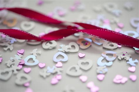 Free Stock Photo 3825-pink ribbon and wedding confetti | freeimageslive