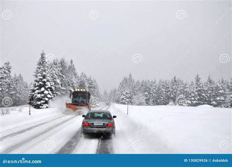 Difficult Traffic after Snowing. the Snow Cleaner Operatively Cleans the Snow-covered Mountain ...