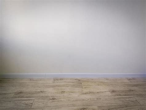 Empty room interior - white wall and wooden floor 12886340 Stock Photo at Vecteezy