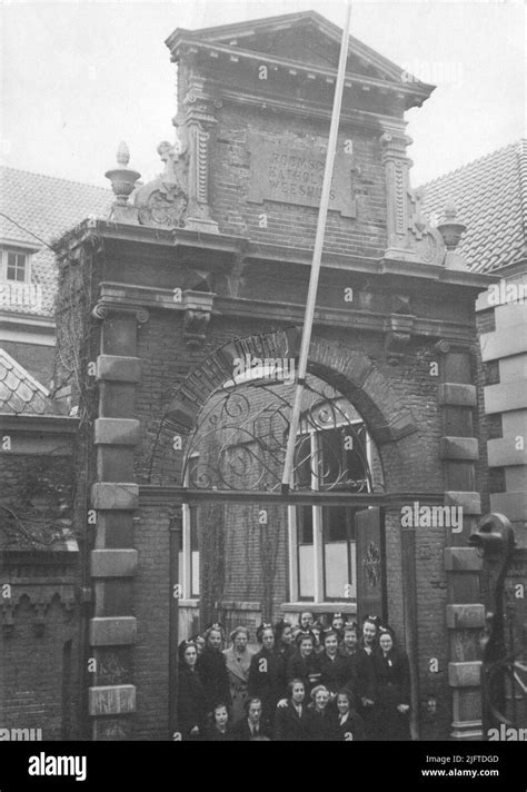 The gate of the Catholic orphanage; with a number of orphans Stock ...