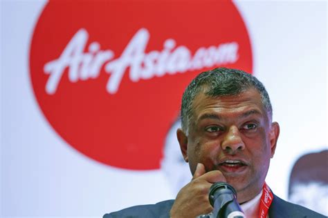 Yes, That's Tony Fernandes Vacuuming The Inside Of An AirAsia Plane