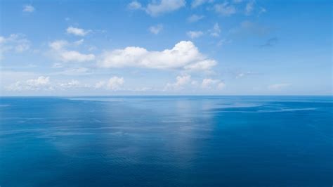 Premium Photo | Amazing aerial view of tropical sea blue ocean water sea surface background.