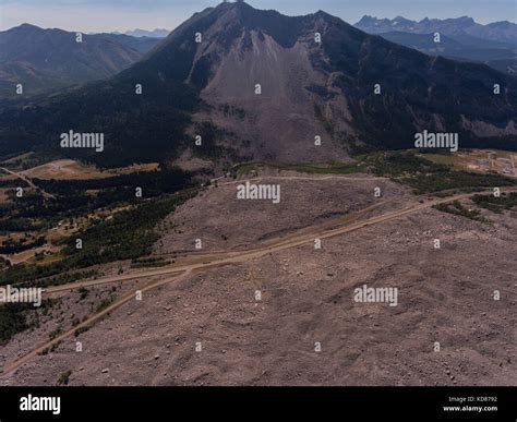 oblique aerial view of Turtle Mountain and the deadly 1903 Frank slide with Highway 3 cut across ...