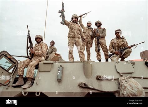 Saudi Arabian national guard soldiers celebrate after leading coalition forces in the recapture ...