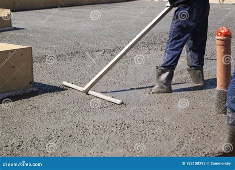 Worker Leveling Fresh Concrete Slab with a Special Working Tool Stock Photo - Image of mortar ...