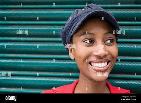 Young woman wearing cap Stock Photo - Alamy