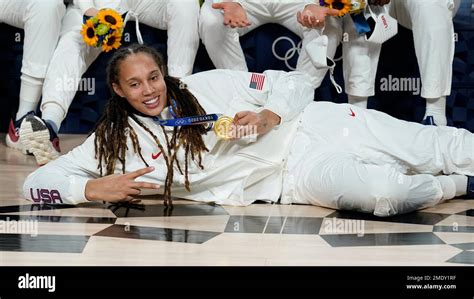 United States's Brittney Griner (15) poses with her gold medal during the medal ceremony for ...