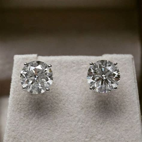 A pair of beautiful 3 carat diamond stud earrings. Total weight 6.02ct ...