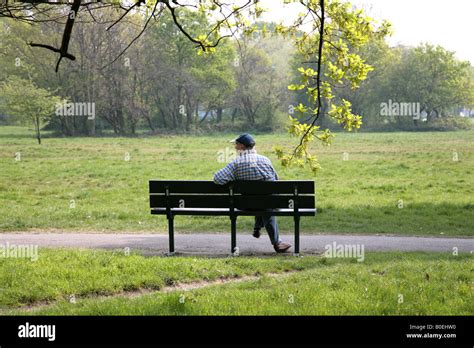 man sitting alone on park bench Stock Photo: 17531724 - Alamy
