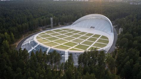 Mežaparks Open-Air Stage resonates with its forested surroundings in Riga, Latvia