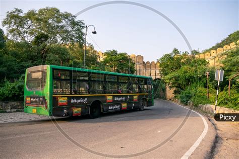 Image of A Jaipur city bus or low floor bus moving on amer road ...