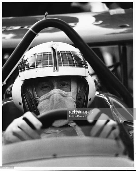 News Photo : Scottish racing driver Jackie Stewart sits at the ...