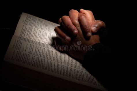 African American Man Praying with Hands on Top of the Bible Stock Image - Image of jesus, sacred ...