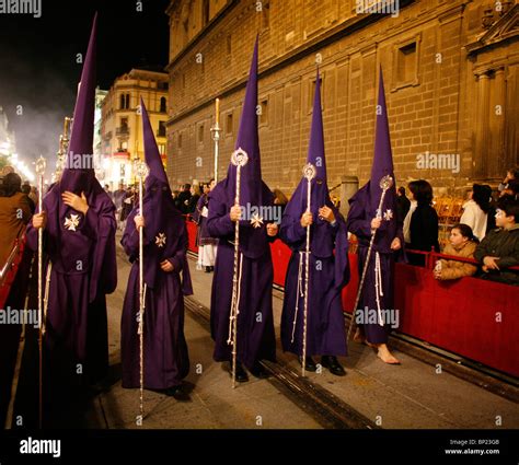 Hooded members of a Brotherhood during the Semana Santa processions in ...