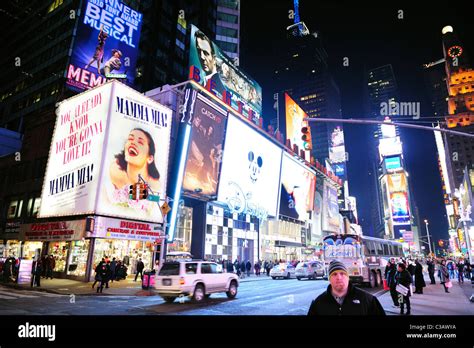 Times Square at night street view with busy traffic in Manhattan, New ...