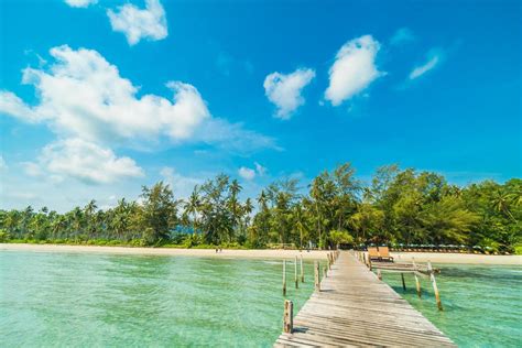 Wooden pier on tropical beach 2008201 Stock Photo at Vecteezy