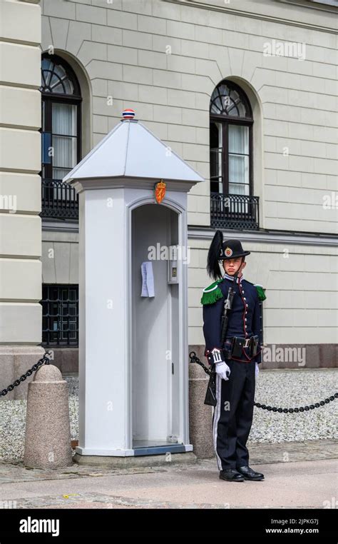 OSLO, NORWAY – JULY 11, 2022: Oslo, Norwegian Royal Palace, palace guard standing post at guard ...