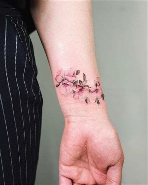 25+ Creative Wrist Tattoos Ideas For Modern Girls | Flower wrist tattoos, Wrist bracelet tattoo ...