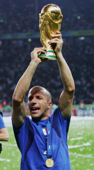 Alessandro Del Piero of Italy lifts the World Cup trophy aloft following his team's victory in a ...