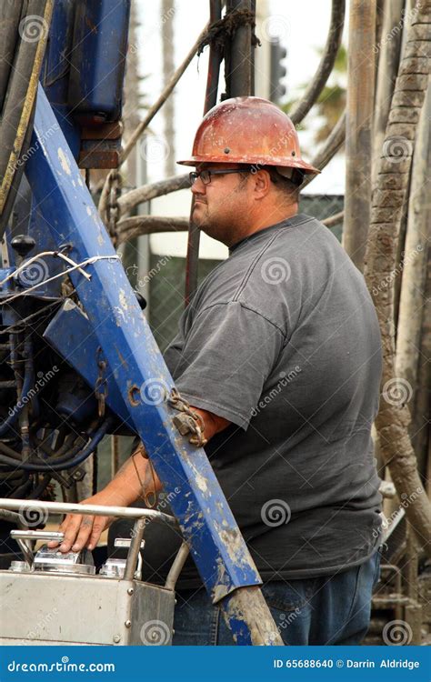 Oil Worker at Oil Well Abandoning Jobsite Stock Photo - Image of ...