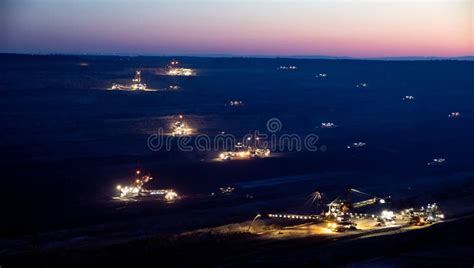 Heavy Mining Equipment at Work in an Open-pit Mine at Dusk Editorial ...