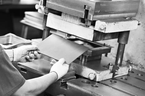 worker at manufacture workshop operating metal press machine | Meta Fab ...