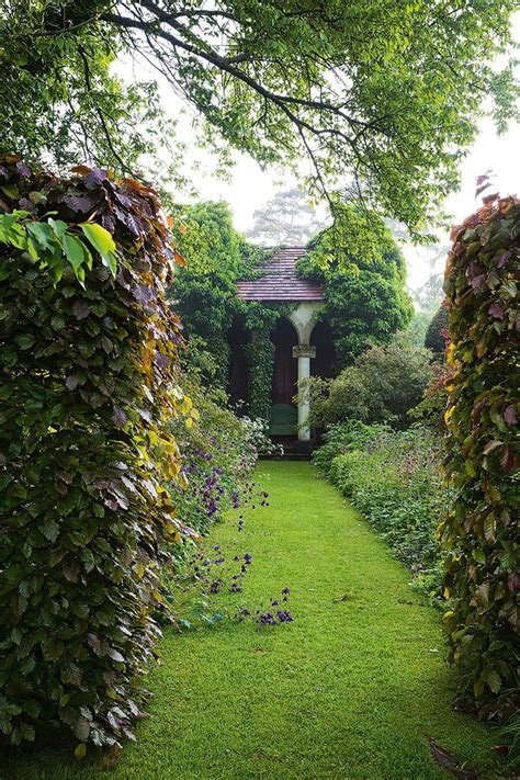 A cottage garden with formal elements in the English countryside ...