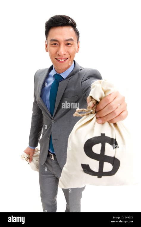 The business man carrying a dollar sign Purse Stock Photo - Alamy