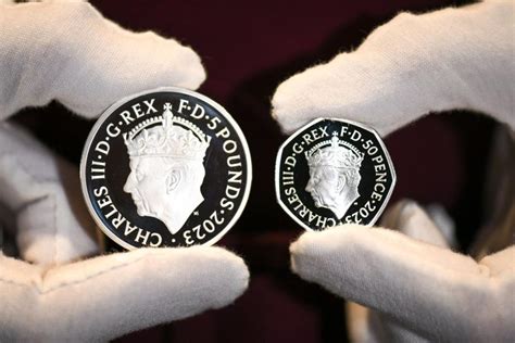 Coronation coins with first ever crowned effigy of King Charles III ...