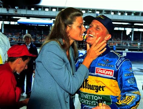 1995 BRITISH GP. Johnny Herbert celebrates with his wife