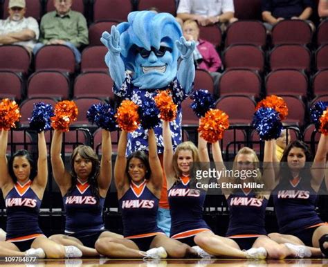 Pepperdine Waves mascot Willie the Wave appears behind Pepperdine ...