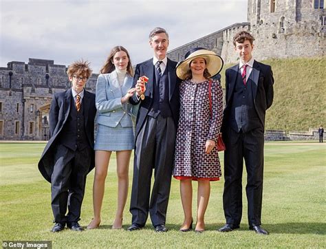 Arise Sir Jacob! Ex-Cabinet minister Rees-Mogg is joined by three of his six children as he ...