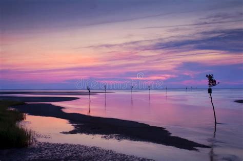 Rock Harbor Beach at Sunset Stock Photo - Image of purple, silhouette: 10317536