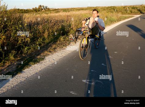 Cyclists using the Ile de Re cyclepaths Stock Photo - Alamy