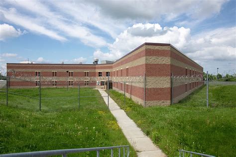 Exterior of prison cell block with overgrown yard Photograph by Karen Foley - Fine Art America