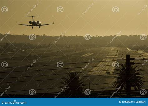 Airplane Landing at Sunset. Stock Photo - Image of vacations, engine ...