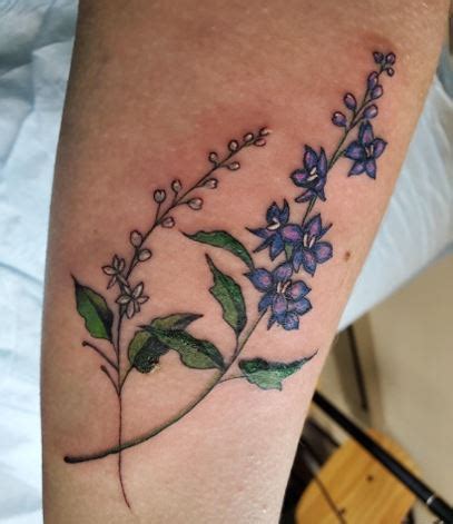 BEAUTIFUL LARKSPUR FLOWER TATTOOS TO IMPROVE YOUR PERSONALITY - Tat Hit