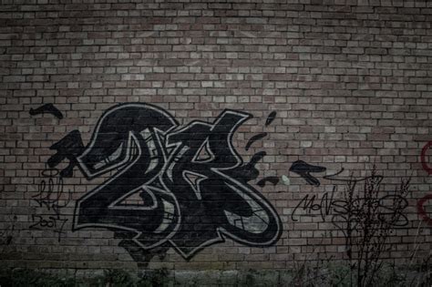 Black Brick Wall With Graffiti - HD Wallpaper | Black brick wall, Black ...