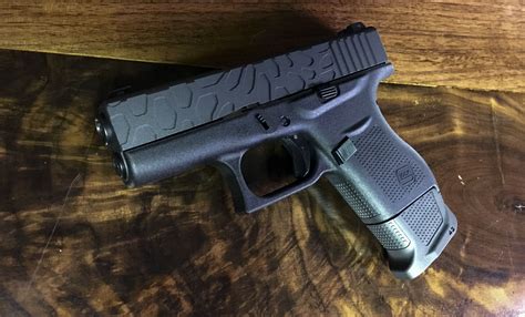 GLOCK 43 CUSTOM SLIDE MILLING + GUN METAL GREY CERAKOTE | Foley Defense