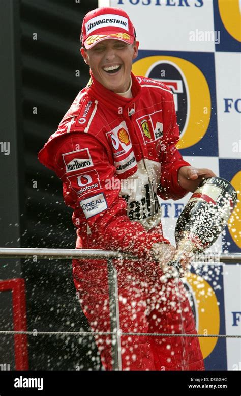 (dpa) - German Ferrari Formula One driver Michael Schumacher splashes ...