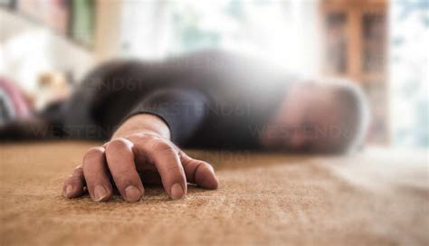 Close-Up Of Man Sleeping On Floor stock photo