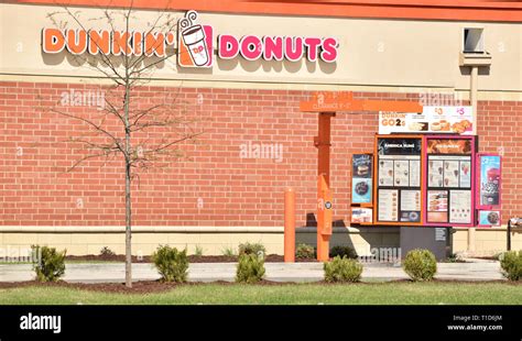 Dunkin' Donuts donut shop drive thru and drive thru menu Stock Photo ...