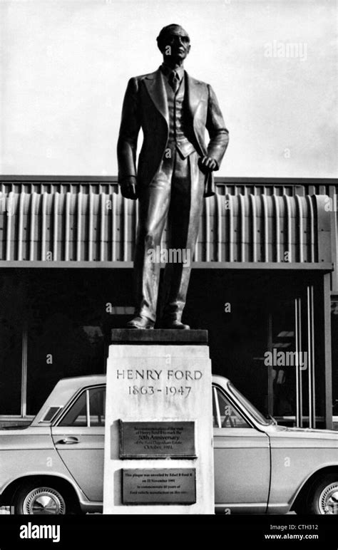 Statue of Henry Ford at the Dagenham Plant Essex UK with 1960's Ford ...